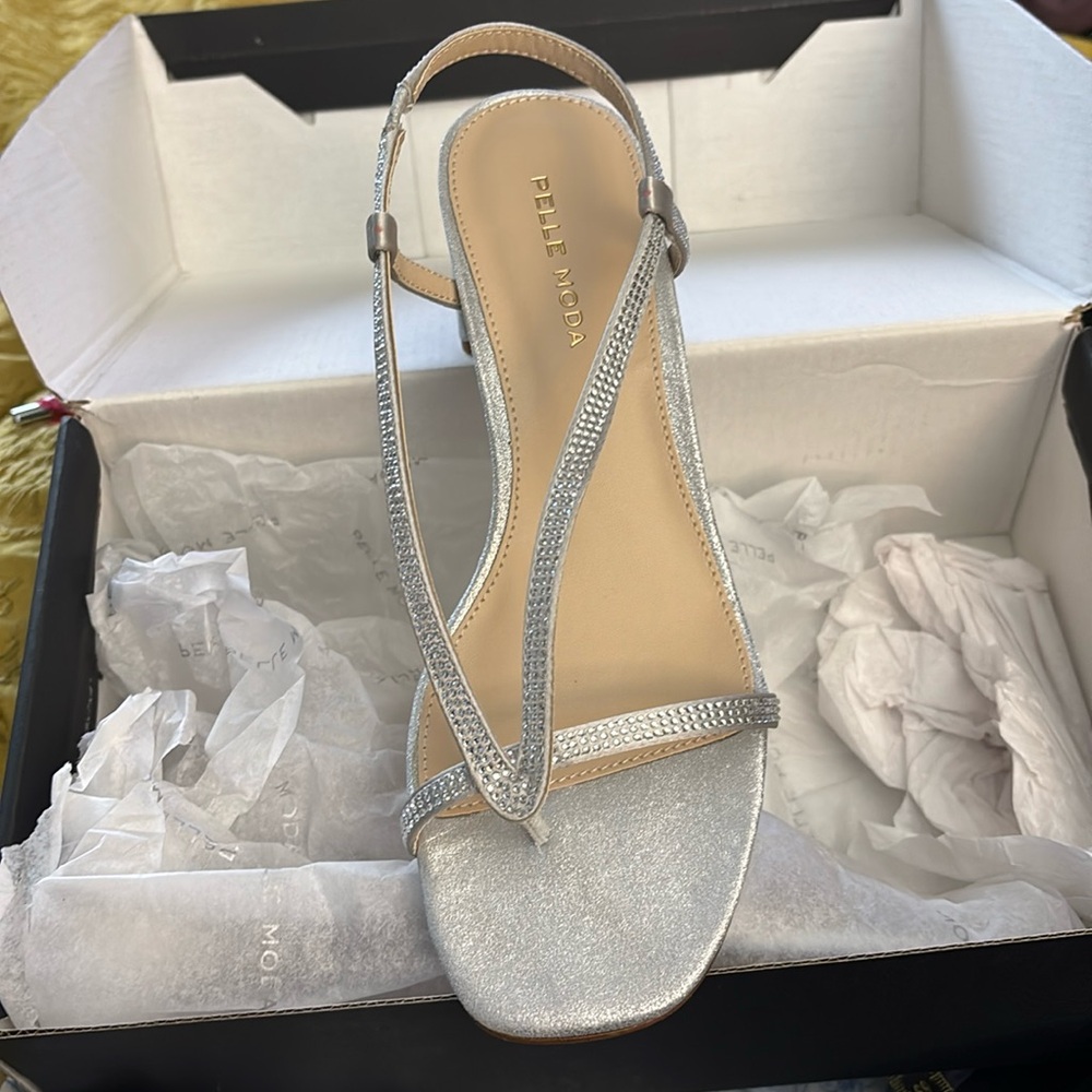 Silver sandals. Size 7.5. New in box.
